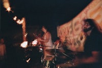 a group of people playing drums in a dark room