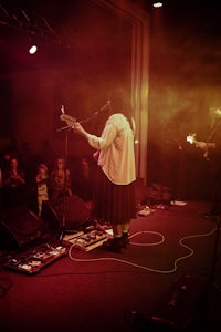 a group of people on stage at a concert